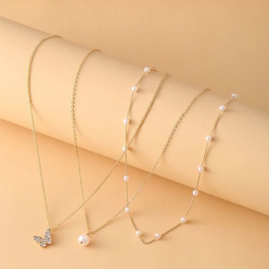 3 LAYERED PEARL BUTTERFLY NECKLACE